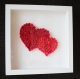 2 cœurs en roses miniatures dans une boîte d'ombre