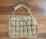 Nature's harmony: beige and dark green crochet bag with elegant strand design