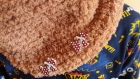 Snood /tour de cou marron  tricote en laine decore de boutons chiens assorties