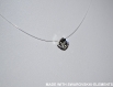 Swarovski  collier avec pendentif rond sur fil nylon