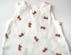 Robe bébé blanche, avec des fraises 