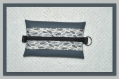 Porte monnaie en simili cuir gris avec fermeture zippée aux coloris assortis 