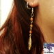 Tyria - boucles d'oreille en métal doré pendentif plume dorée et perles agathe rouge